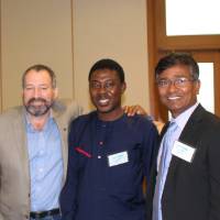 Dr. Bawole, friend, and Dr. Molla standing together, smiling